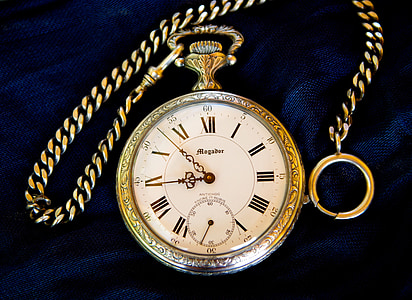gold-colored roman pocket watch thumbnail