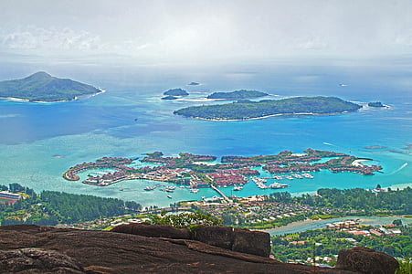 aerial view photography of houses surrounded by body of water during daytime thumbnail