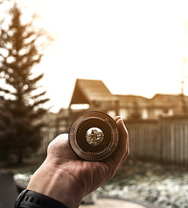 person holding gray scope thumbnail