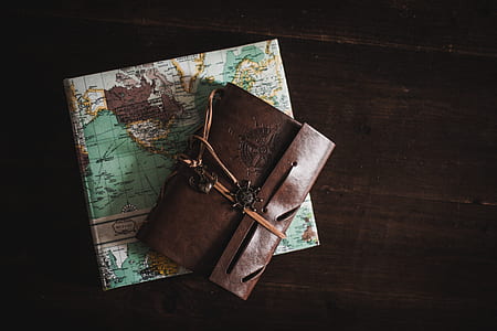 brown leather pouch on teal and white map thumbnail