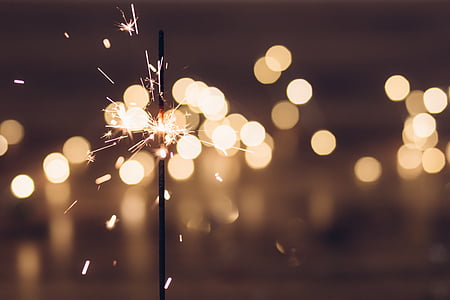 lit sparkler selective focus photography thumbnail