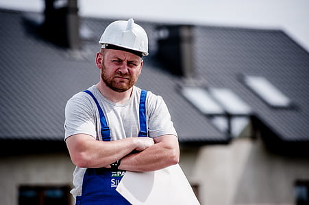 selective focus photographed of man wearing white safety helmet thumbnail