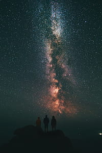 three silhouette of person looking at the stars thumbnail