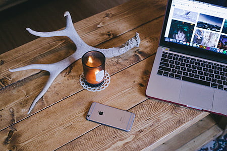silver MacBook Pro beside space gray iPhone 6 thumbnail