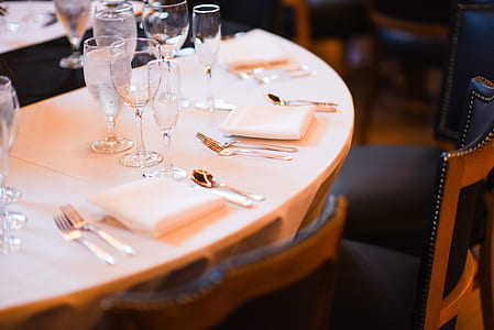 clear wine glasses on white table thumbnail