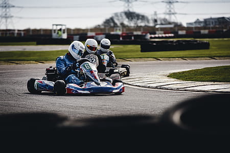 Three Men Riding on Go Karts thumbnail