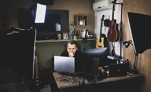 Man Siting in Front of Computer Monitor thumbnail