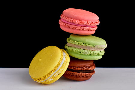 four macarons on white surface thumbnail