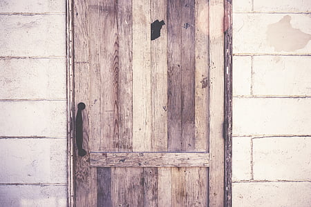 brown wooden door with gray hallow block wall thumbnail