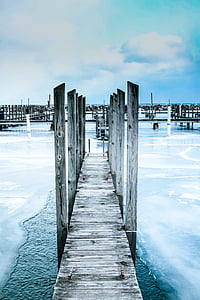 gray wooden dock above body of water thumbnail