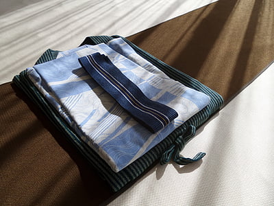 folded fabric cover on brown surface thumbnail