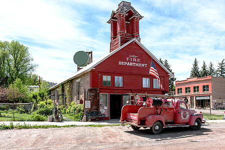 firetruck parked in front of the fire department building thumbnail