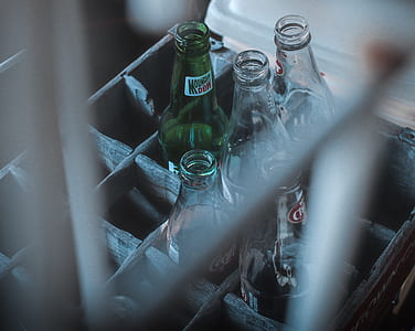 selective focus photography of glass soda bottles thumbnail