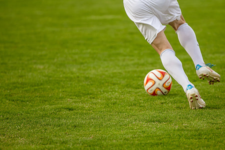 football player trying to kick the ball thumbnail