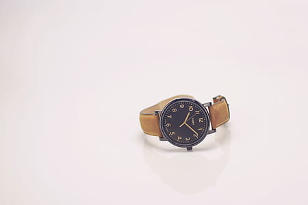 round silver-colored analog watch displaying 10:10 thumbnail