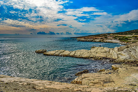 seashore under blue and white sky thumbnail