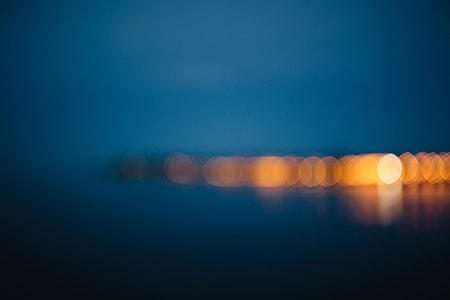 City lights reflected in the water at night thumbnail