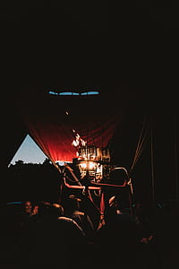 people inside hot air balloon under lighted gray balloon torch thumbnail