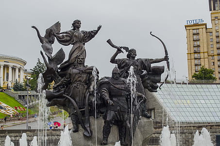 water fountains with statues during daytime thumbnail