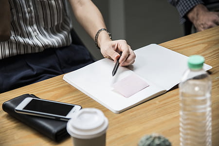 Photo of Person Holding a Pen thumbnail