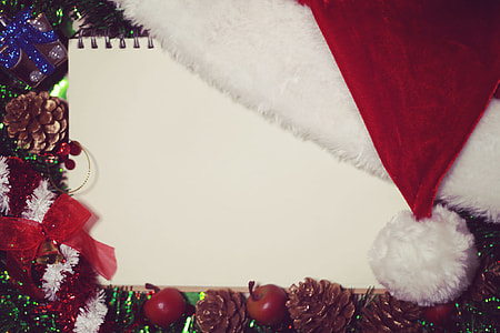 white spiral notebook and Santa hat thumbnail