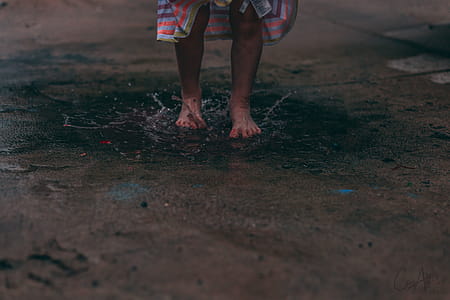 Person Standing On Puddle Of Water thumbnail