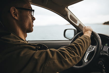 Man With Glasses Driving Photo thumbnail