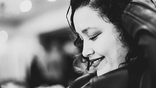 grayscale photo of woman smiling thumbnail