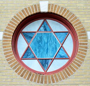 close-up photography of Star of David-themed window thumbnail