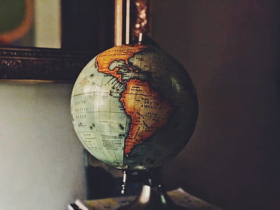 desk globe on brown wooden table thumbnail