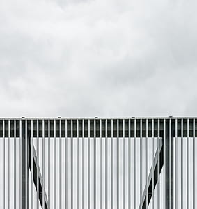 view of handrail under cloudy sky thumbnail