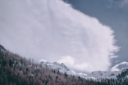 snow capped mountain under cloudy sky at daytime thumbnail