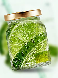 sliced of lemons inside of glass jar thumbnail