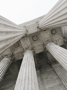 gray concrete pillars in low angle photography thumbnail