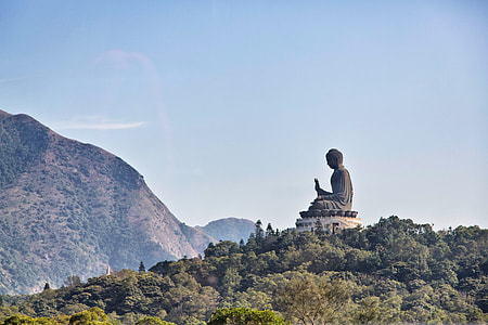 Buddha statue on mountain during daytime thumbnail