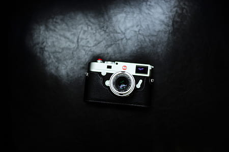 tilt-shift lens photography of black and gray camera thumbnail