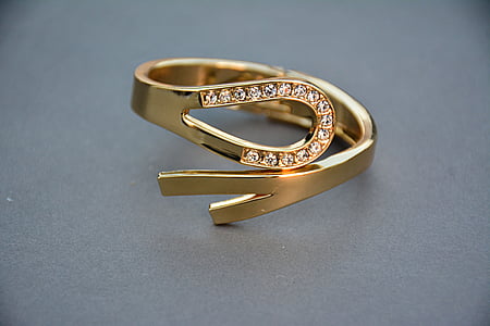 gold-colored ring with clear gemstones thumbnail
