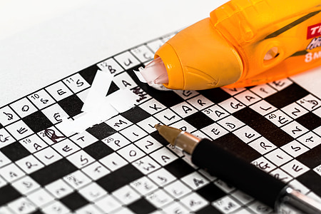 black and white crossword puzzle with pen and correction tape thumbnail