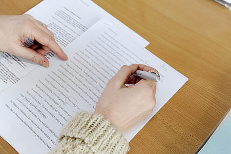 person holding pen thumbnail