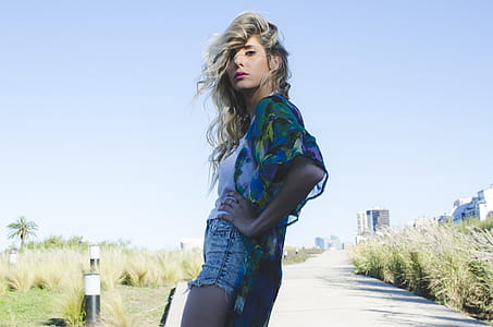 Woman in Green and Blue Cardigan thumbnail