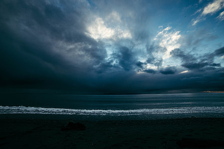 body of water under blue and white sky thumbnail