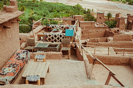 furnitures placed on brown clay structure thumbnail