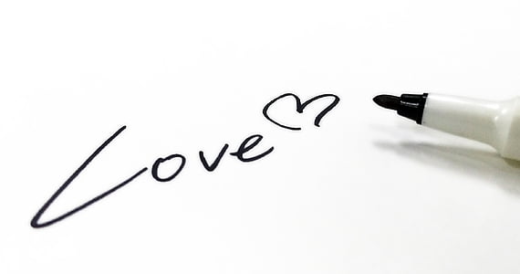 love handwritten text near black marker thumbnail