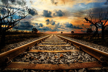 worm's eye photography of train rail thumbnail