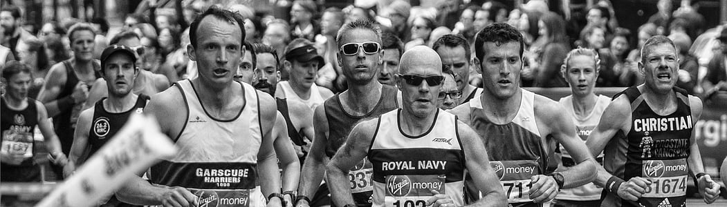 grayscale photo of men on running marathon thumbnail