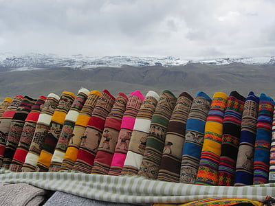 assorted-color textile lot under gray clouds at daytime thumbnail