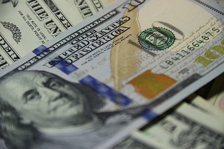 macro photography of 100 US dollar banknotes thumbnail