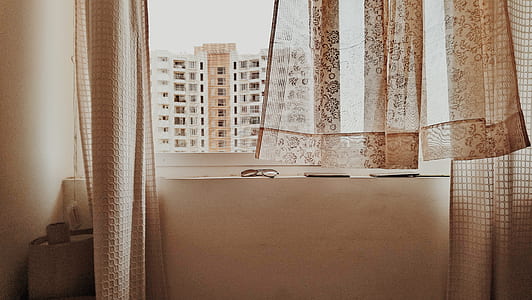 white and brown floral window curtain during daytime photo thumbnail