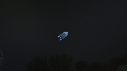 Bird's Eye-view Photo of Blue Boat thumbnail