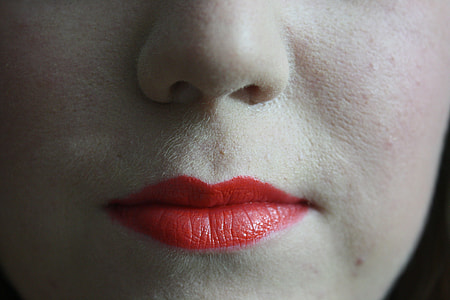 close photo of woman's red lipstick thumbnail